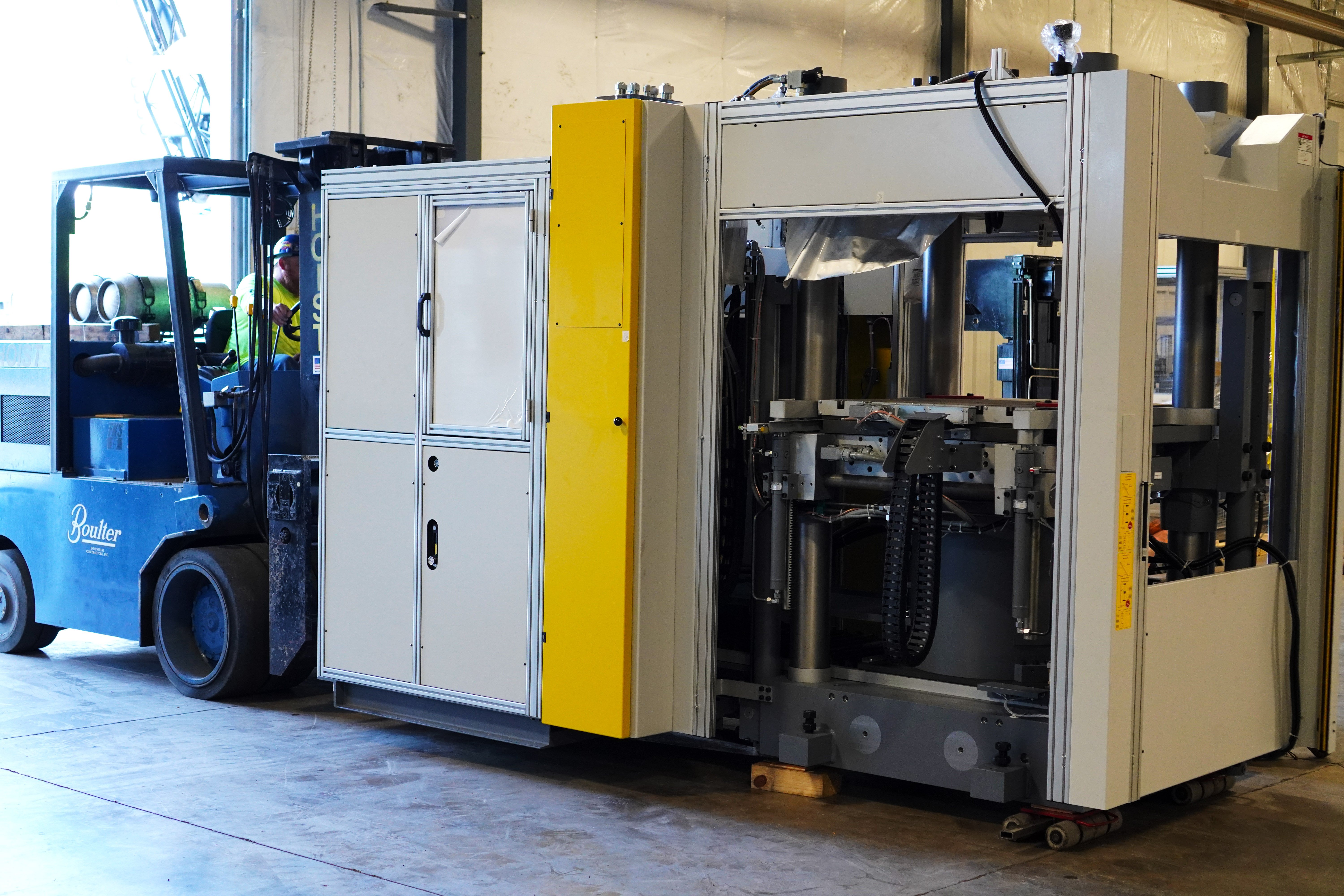 Moving heavy machinery into warehouse
